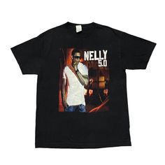 a black t - shirt with an image of a man wearing sunglasses