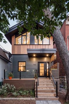 a house with stairs leading up to the front door