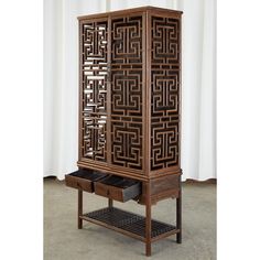 Magnificent Chinese two-piece kitchen cabinet featuring a carved lattice open fretwork cupboard case. Made in the Qing style from beautifully grained hardwood. The kitchen cabinet top has two doors with brass pulls that open to a three shelf storage area. The bottom section has two storage shelves and an open pot board shelf with a lattice bottom. Excellent joinery and craftsmanship with intricate details and fretwork lattice design on three sides. Lovely aged patina on the wood finish. From an Japanese Kitchen Cabinets, Pagoda Top Cabinet, Chinese Interior Design Modern, Chinese Interior Design, Japan Kitchen, Top Kitchen Cabinets, Chinese Courtyard, Asian Inspired Decor, Modern Japanese Interior