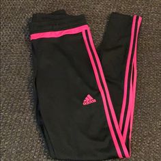 Adidas Black Sweat Pants With Bright Pink Trim. Zippers Are The Bottom To Get Over Shoes And Zipper Hidden Pockets. Never Worn! Bright Pink Stripes. Fitted Pink Adidas Activewear, Fitted Pink Adidas Bottoms, Fitted Pink Sweatpants For Workout, Adidas Pink Sports Bottoms, Pink Adidas Sports Bottoms, Pink Stretch Adidas Bottoms, Pink Adidas Pants For Loungewear, Adidas Pink Sports Pants, Pink Workout Sweatpants