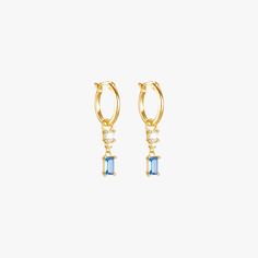 A pair of gold hoop earrings with a blue gemstone and diamond drop. Elegant Blue Drop Huggie Earrings, Elegant Blue Single Huggie Earring, M F, Halloween Earrings, Blue Zircon, Earrings Blue, Earring Sale, Single Earring, Charm Earrings