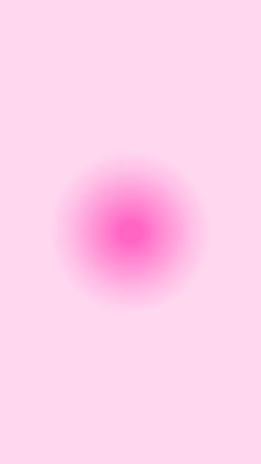 an image of a pink circle on a light pink background that appears to be blurry