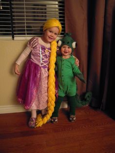 two children dressed in costumes standing next to each other