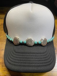 Beaded trucker hat chain approximately 10" long with silver lobster clasps to attach to mesh of trucker hat turquoise & cream magnesite bead. Hat Chain Only. HAT NOT INCLUDED Adjustable Southwestern Jewelry With Silver Beads, Adjustable Southwestern Silver Beaded Jewelry, Southwestern Jewelry With Adjustable Chain, Western Jewelry With Adjustable Chain, Southwestern Style Jewelry With Adjustable Chain, Western Style Jewelry With Adjustable Chain, Adjustable Silver Beads Jewelry For Festival, Adjustable Turquoise Jewelry With Lobster Clasp, Adjustable Bohemian Turquoise Necklace With Beaded Chain