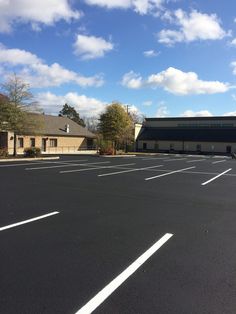 an empty parking lot in front of a building