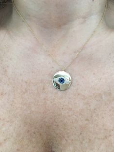 "14K Gold Diamond and Sapphire Evil Eye Necklace is beautifully set in a round 14k gold disk in the shape of an eye with 1 black diamond in the center. It's the perfect piece to have and never take off. The evil eye is believed to ward off an evil and bless the person wearing it! It comes on a 18\" 14k gold chain, but I put an extra loop at 17\" and 16\" so that you can wear it at any of those lengths. Great gift for bridesmaids, birthdays, graduation, or any other special occasion! -46 Diamonds Yellow Gold Round Jewelry With Diamond Eyes, Yellow Gold Evil Eye Jewelry For Anniversary, Yellow Gold Medallion Jewelry With Evil Eye, Yellow Gold Jewelry With Evil Eye Medallion, Yellow Gold Evil Eye Medallion Jewelry, Gold Round Evil Eye Jewelry, Yellow Gold Round Pendant Jewelry With Diamond Eyes, Gold Evil Eye Round Jewelry, Anniversary Round Necklaces With Diamond Eyes