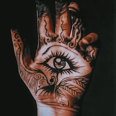 a person's hand with an all seeing eye tattoo on it and the palm of their hand