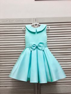 Teal mint turquoise pageant interview dress with bow belt and collar/ Knee length dress/ Girl Interview outfit /Custom pageant dress This beautiful dress is made from high quality satin. This material has a shape and less shine. The dress has natural lining and zipper back. It is easy to care and comfortable to wear. The dress comes in knee length. It has tulle petticoat. The dress is perfect for interview competition and other pageant events. It is absolutely stunning on! Materials Satin, visco Light Blue Princess Dress With Bow, Elegant Green Pageant Dress For Dress-up, Light Blue Elegant Dress For Dress-up, Elegant Light Blue Dress For Dress-up Occasions, Elegant Light Blue Dress For Dress-up, Elegant Green Pageant Dress For Party, Elegant Green Pageant Dress, Elegant Light Blue Pageant Dress, Elegant Light Blue Pageant Dress For Parties