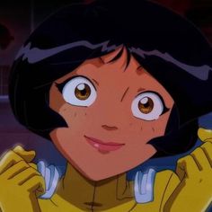 an animated image of a woman with brown eyes and black hair wearing a yellow shirt