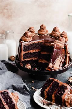 a chocolate cake on a plate with one slice cut out