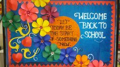 a bulletin board with flowers and words on it that says, welcome back to school let today be the start of something new