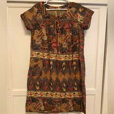 Autumn Colored, Batik House Dress, Like New, Never Worn. Possibly Handmade, It Was A Gift. No Size But Would Fit Anywhere From A Small To Large. Casual Batik Print Tunic Dress, Casual Brown Batik Print Dress, Red Short Sleeve Dress With Batik Print, Casual Brown Dress With Batik Print, Patterned Batik Print Short Sleeve Dress, Patterned Batik Print Dress With Short Sleeves, Patterned Short Sleeve Dress With Batik Print, House Dress, Fall Colors