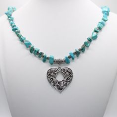 Handmade Tibetan silver Heart flower filigree synthetic turquoise chip necklace with antique silver ridged beads. This necklace is perfect for any season especially the summer months. Add a touch of exotic holidays past with this gorgeous necklace.  .  Made with  ⭐ Tibetan silver open heart flower butterfly filigree charm  ⭐ Synthetic turquoise chip beads ⭐ 4mm antique silver round ridged beads   ⭐ Tibetan flower hanger connector ⭐ Beadalon stringing wire Finished with a silver plated lobster cl Bohemian Turquoise Heart Pendant Necklace, Bohemian Silver Turquoise Necklace For Beach, Bohemian Heart-shaped Turquoise Necklace With Heart Beads, Bohemian Turquoise Heart Shaped Beaded Necklaces, Bohemian Turquoise Heart-shaped Beaded Necklace, Bohemian Turquoise Heart Shaped Beaded Necklace, Bohemian Turquoise Heart Necklace, Bohemian Heart-shaped Turquoise Necklace, Bohemian Turquoise Necklace With Heart Beads