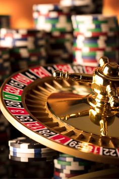 a golden cadus wheel with casino chips in the background