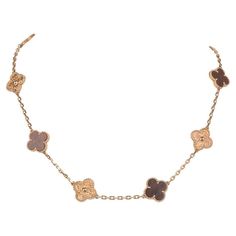 Extremely are and highly collectable Alhambra Collection necklace in 18K Rose Gold and Bois d'Amourette (letterwood). Vintage and aged to perfection this series is created by a French craftsman using antique machinery dating back to the era of Louis XIV. 10 alternating motifs of Rose Gold and Bois d'Amourette. Signature stamps on necklace. Necklace comes with authenticity card and gift box. final sale NECKLACE MEASURES: LENGTH 16" MOTIF .59" X .59" CONDITION: LIKE NEW French Craftsman, Van Cleef Necklace, Classy Purses, Van Cleef And Arpels Jewelry, Expensive Taste, Van Cleef And Arpels, Louis Xiv, Aged To Perfection, Classy Jewelry