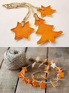 two pictures with orange and white stars hanging from the ceiling, one is made out of wood