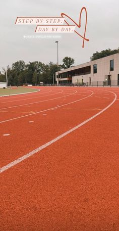 an empty track with the words step by step day by day written on it in red