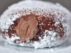 powdered sugar and chocolate pastry sitting on top of each other