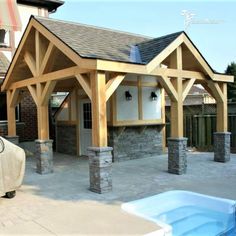 an outdoor covered patio with a hot tub