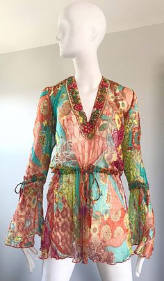 For Sale on 1stDibs - Stunning Vintage 1990s MAURIZIA BYOUX colorful mixed patterned silk chiffon Italian tunic blouse! Features beadwork along the neckline. Bell sleeves have Multicolor Silk Blouse For Beach, Bohemian Long Sleeve Silk Chiffon Dress, Multicolor Silk Beach Blouse, Long Sleeve Bohemian Silk Chiffon Dress, Bohemian Style Multicolor Blouse For Party, Bohemian Style Multicolor Party Blouse, Bohemian Multicolor Party Blouse, Multicolor Sequin Blouse For Spring, Bohemian Multicolor Silk Blouse