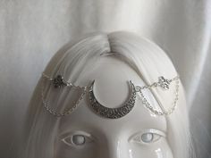 A gorgeous head chain featuring a silver filigree moon and two filigree charms. Perfect for renaissance fairs, weddings, cosplay, or any event of your choosing! Choose between silver or bronze! Fits head circumferences from 21 inches to 24.5 inches. Handmade Silver Fantasy Body Jewelry, Silver Gothic Headpiece For Festivals, Silver Bohemian Headband, Handmade Silver Body Jewelry For Festivals, Fantasy Festival Jewelry Headband, Fantasy Festival Headband Jewelry, Silver Fantasy Jewelry For Festivals, Bohemian Silver Adjustable Headpieces, Spiritual Silver Body Jewelry For Festivals