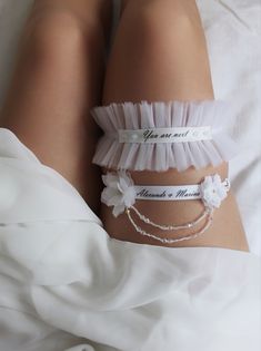 a woman's white garter with words on it