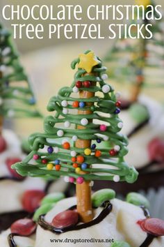 chocolate christmas tree pretzel sticks on top of cupcakes