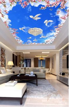 a living room filled with lots of furniture and paintings on the ceiling