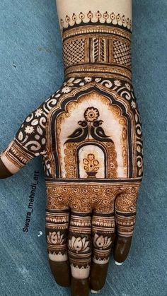 the hand is decorated with intricate designs