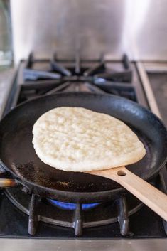 an omelet is being cooked in a skillet on top of the stove