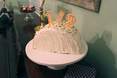 a birthday cake sitting on top of a white plate