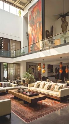 a living room filled with furniture and lots of windows