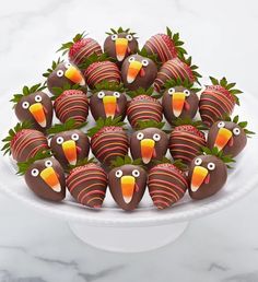 chocolate covered strawberries decorated like birds with strawberries in the shape of turkeys