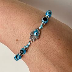 New Adjustable Hamsa Evil Eye Bracelet. Blue Evil Eyes. Blue Eye Inside Of The Beautiful Rhinestone Hamsa. Silver Accents. Adjustable Blue Jewelry With Silver Beads, Handmade Blue Sterling Silver Beaded Bracelets, Blue Crystal Bracelet With Silver Beads, Adjustable Light Blue Crystal Bracelet, Light Blue Adjustable Crystal Bracelet, Adjustable Light Blue Crystal Bracelet For Gift, Blue Hypoallergenic Crystal Bracelet As Gift, Adjustable Silver Evil Eye Bracelet, Handmade Blue Evil Eye Bracelet In Sterling Silver