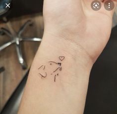 a small elephant tattoo on the wrist is shown in black ink, and it's outline has been drawn