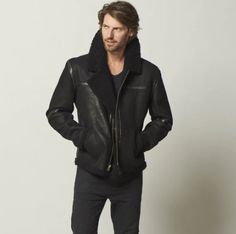 Men's Fur Aviator Sheepskin Leather Jacket In Black The Men's aviator sheepskin leather jacket is perfect for the cold weather of winter. This stylish, soft leather jacket features a detachable bomber-style zip hood and shoulder epaulettes for added range of motion. The zipper closure seals in warmth and keeps out drafts, while the open hem and cuffs allow for easy movement. Outer Shell: Full Grain Leather Leather Type: Sheepskin Leather Finish: Semi-aniline Inner Shell: Faux Shearling Feature: Oversized Shearling Collar Closure Style: Zipper Collar Style: Turn Down Cuffs Style: Open Hem Inside Pockets: Two Outside Pockets: Two Side Pockets Color: Black Leather Biker Jacket For Cold Weather, Masculine Winter Leather Jacket, Luxury Classic Aviator Leather Jacket, Black Fitted Sheepskin Leather Jacket, Black Shearling Leather Jacket With Zipper, Luxury Aviator Sheepskin Leather Jacket, Luxury Men's Shearling Leather Jacket, Leather Shorts Women, Short Leather Skirts