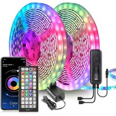 three different colored lights and remotes on a white background with an iphone next to them