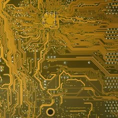 an electronic circuit board with many different types of electronics on it, all in gold and black