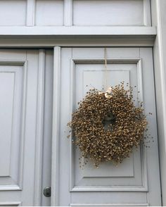 a door with a wreath hanging on it