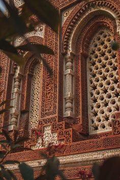 an intricately designed window on the side of a building