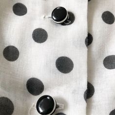 "Polka dots and stripes! One of my fav graphic combinations! Better yet! Black and white This has got to be one of the best 60s/70s pieces ever! A great flirty and ladylike dress. I especially love the black buttons with the white trim! Slightly sheer but a crinoline will easily solve this. Condition: Excellent. Very very slight fabric fade. I'm actually not sure if it's meant to be that way but just mentioning for accuracy. Label: Avalon Classics Bust 37\" Waist 27\" (can be cinched smaller) Le Cheap Casual Polka Dot Mini Dress, Luxury Sleeveless Polka Dot Dress, Black And White Stripe Tea Dress, Fitted White Polka Dot Dress, Luxury Polka Dot Sleeveless Dress, White Dalmation Dress, Luxury Polka Dot Dresses For Daywear, Cheap Polka Dot Party Dresses, Black And White Dalmation Dress