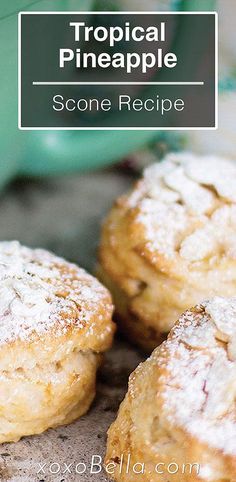 some powdered sugar cookies on top of a wooden table with the title tropical pineapple scone recipe