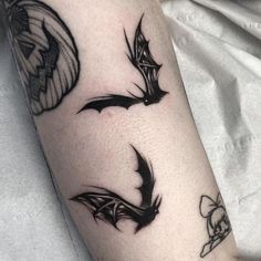 a couple of bats that are on the arm