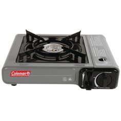 a gas stove with the lid open on a white background