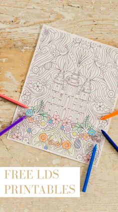 a coloring page with three colored pencils next to it and the title free kids's printables