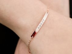 BAR NAME BRACELET  This beautiful name bar bracelet is perfect for everyday wear and it would make a great gift for a Mom, bridesmaid, friend, or any loved one.  DESCRIPTION * Material: High quality solid 925 sterling silver * Dimensions: 35x4mm bar * Finish: Sterling Silver ∙ 18K Gold vermeil  ∙ Rose Gold vermeil  * All our jewelry is custom and handmade with love in our studio * Engraved with a high precision jewelry engraver imported from France, extremely clear and easy to read * Handmade to order, please allow 1-3 days for us to make your item before shipping * Jewelry comes beautifully packaged in a custom Susabella box - ready to give to the recipient or keep for yourself The bracelet measures approx 6.3 inches and comes with an extender that adds 1.2 inches. HOW TO ORDER 1) Select Minimalist Name Bracelet For Bridesmaid Gift, Adjustable Minimalist Name Bracelet For Bridesmaids, Minimalist Name Bracelet For Everyday, Minimalist Rose Gold Name Bracelet, Minimalist Rose Gold Bracelet With Custom Name, Minimalist Personalized Name Bracelet For Bridesmaid, Personalized Minimalist Name Bracelet For Bridesmaid, Customized Minimalist Name Bracelet, Minimalist Custom Name Bracelet