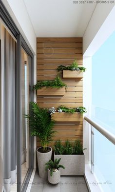 two planters on the side of a building with wooden slats and plants in them