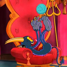 a cartoon character sitting in a chair with a ball of yarn