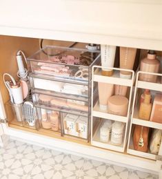 an organized bathroom cabinet filled with cosmetics and personal care items