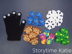 there are many different items made out of felt and plastic on the table with snowflakes